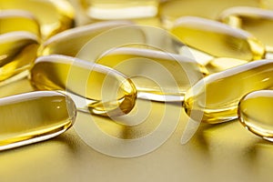 A set of clear yellow capsules with omega-3.