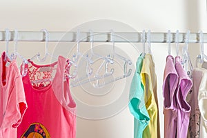 Set of clothes for kids on hangers. Shopping.
