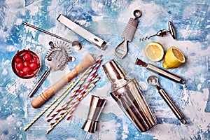 Set of Cocktail Bar utensils with lemon and cherries