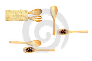 Set coffee beans on wooden spoon isolated