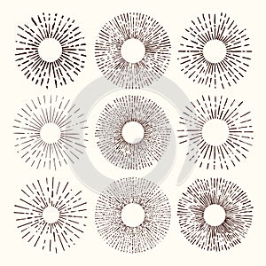 Set and collection of trendy hand drawn retro sunburst/bursting rays design elements.