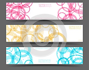 A set of colored banners with geometric elements.