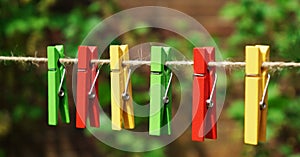 A set of colored garden pegs on a vintage garden string