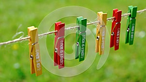 A set of colored green, red and yellow wooden pegs on a vintage string