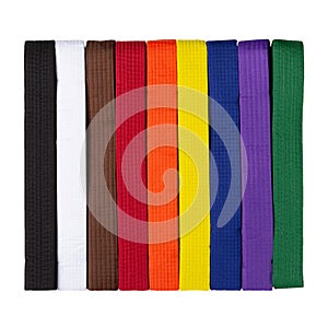 Set of colored kimono belts, for karate, judo and other martial arts, on a white background