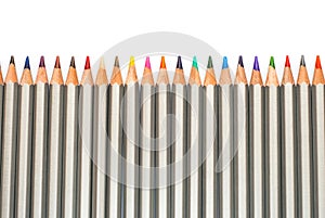 Set of colored pencils. Fence of pencils. On a white background.