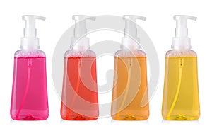 Set of colored plastic bottle with liquid laundry detergent, cleaning agent, bleach or fabric softener isolated on white