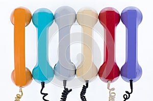 set of colored telephone handsets isolated