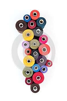 Wallpaper of colored thread coils on white background, sewing and tailoring