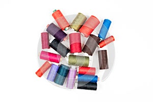 Set of colored thread coils on white background, sewing and tailoring