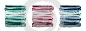 Set of colorful bath towels isolated over white background. Bath towels in stack