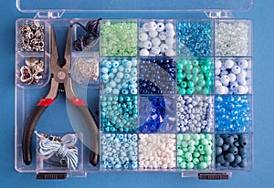 Set of colorful beads and accessories for making Jewelry bracelets of beads and necklaces. DIY bijouterie concept. Flat