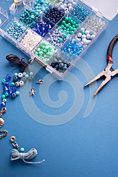 Set of colorful beads and accessories for making Jewelry bracelets of beads and necklaces. DIY bijouterie concept. Flat