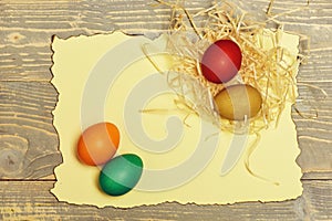 Set with colorful eggs on burnt paper . Happy Easter concept
