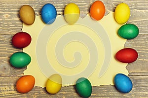 Set with colorful eggs on burnt paper . Happy Easter concept