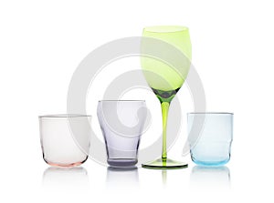 Set of colorful empty glasses on white
