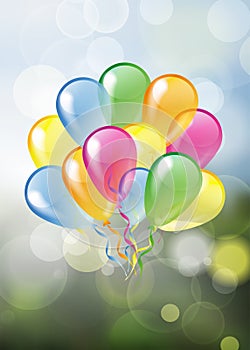 Set of colorful glossy balloons on natural spring blurred bubble