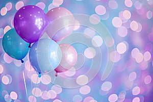 Set of colorful helium balloons floating on colorful bokeh background