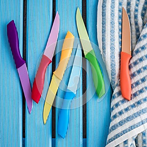 Set of Colorful Kitchen Knives on a Napkin