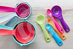 Set of colorful measuring cups and measuring spoons use in cooking.