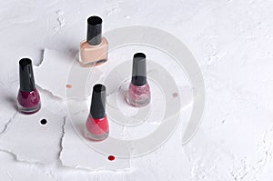 Set of colorful nail polish, samples of different colors on the pieces of paper.Empty space for text photo