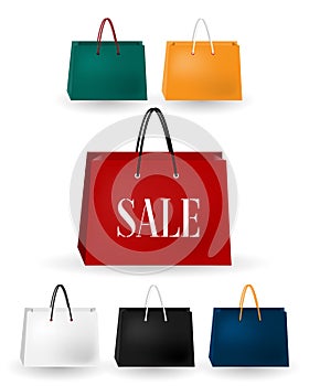 Set of the colorful paper shopping bags isolated on white background