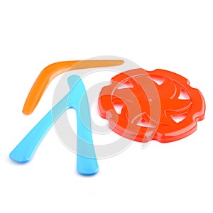 A set of colorful plastic boomerangs and frisbees for outdoor play. Children's active games. Boomerang isolated on a