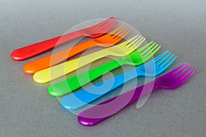 A set of colorful plastic forks.