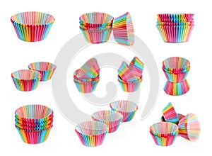 Set of colorful rainbow paper tins for baking cake muffin cupcake isolated