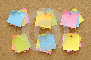 6 set colorful of sticky notes push pins on cork board