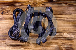 Set of computer psu cables on a wooden background photo