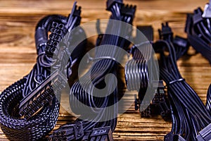 Set of computer psu cables on a wooden background