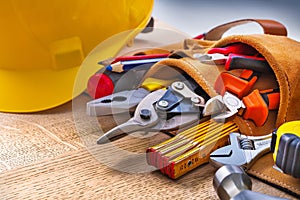 Set of construction tools in toolbelt close up on