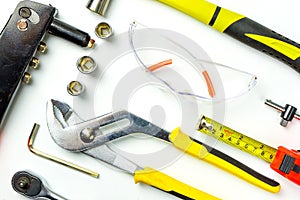 Set of construction tools on white background as wrench, hammer, pliers, socket wrench, spanner, tape measure, electric