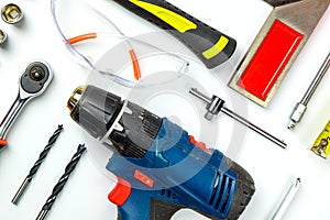 Set of construction tools on white background as wrench, hammer, pliers, socket wrench, spanner, tape measure, electric