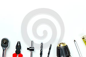 Set of construction tools on white background as wrench, hammer, pliers, socket wrench, spanner, tape measure, electric