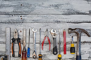 Set of construction tools on the white,rustic wooden background