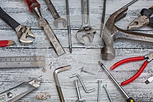 Set of construction tools on the white,rustic wooden background