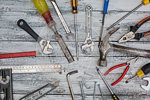 Set of construction tools on the white,rustic wooden background