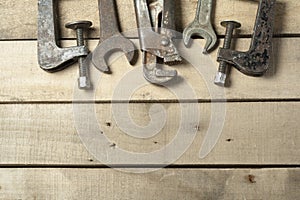 Set of construction tools. Wrench on wooden background