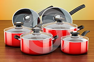 Set of cooking red kitchen utensils and cookware. Pots and pans