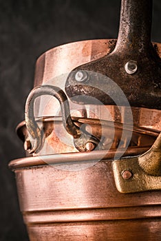 Set of copper pots and pans vertical