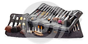 Set cosmetic brushes in black covers isolated on white background.