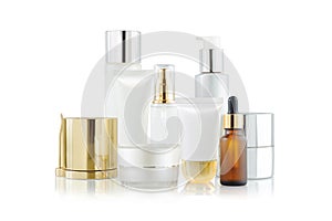 Set of cosmetic containers. Cosmetic product bottles, dispensers, droppers, jars and tubes on white