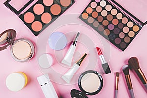 Set of cosmetic makeup tool isolated on pink background, top view, flat lay.