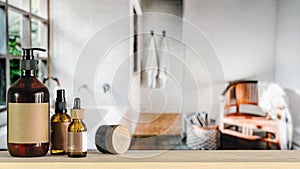 Set of cosmetic products on wooden table in the bathroom