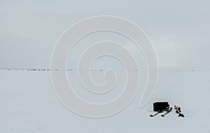 Set of cross-country skis on the ice of the lake. Winter fishing fishermen