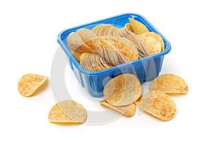 Set of crunchy golden potato chips as heap and in ceramics bowl