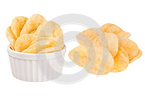 Set of crunchy golden potato chips as heap and in ceramics bowl isolated on white background.