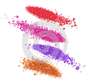 Set of crushed colored eyeshadows on white background